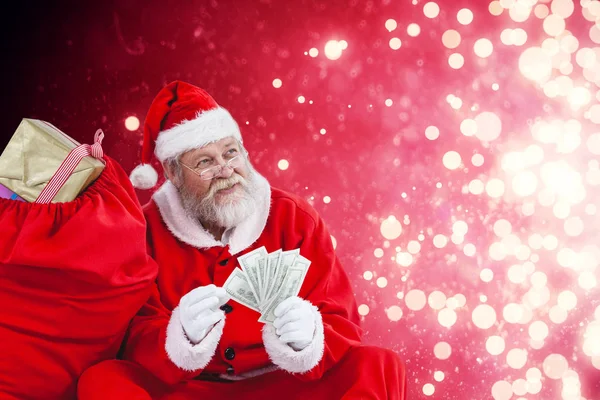 Santa claus räknar sedlar — Stockfoto