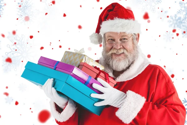 Santa claus håller jul presenterar — Stockfoto