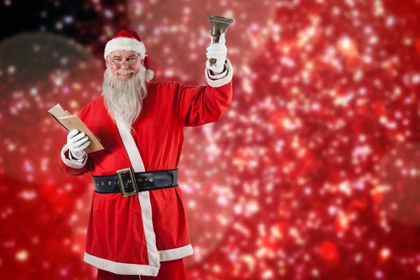 Santa claus håller Bibeln och bell — Stockfoto