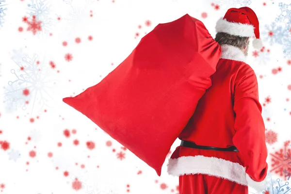 Santa claus llevar bolsa roja — Foto de Stock