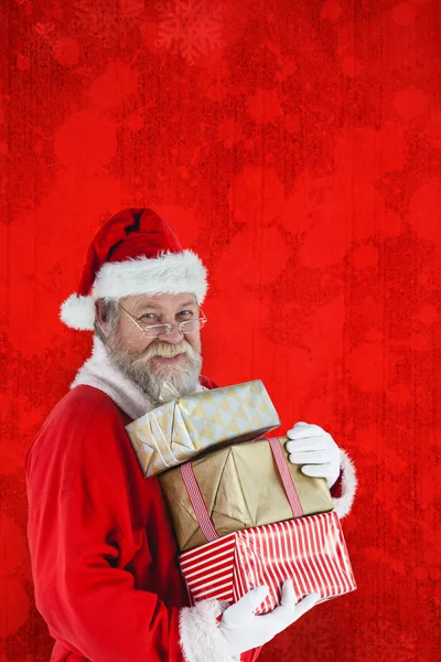 Babbo Natale in possesso di regali di Natale — Foto Stock