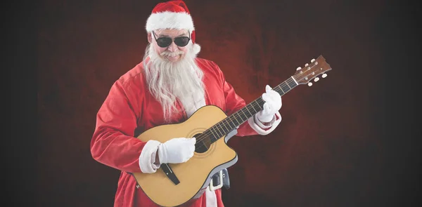 Santa Claus spelar gitarr — Stockfoto