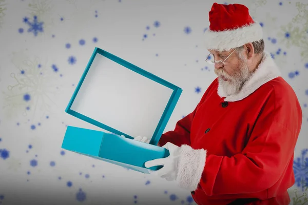 Santa claus opening gift box — Stock Photo, Image