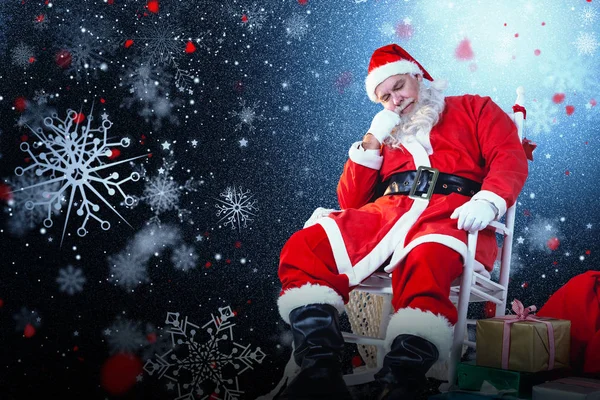 Santa claus ontspannen op stoel Stockfoto