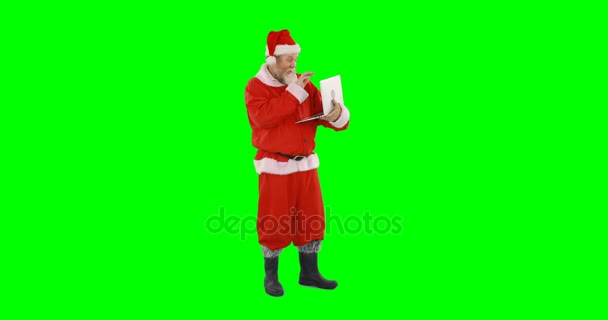 Santa claus using laptop — Stock Video