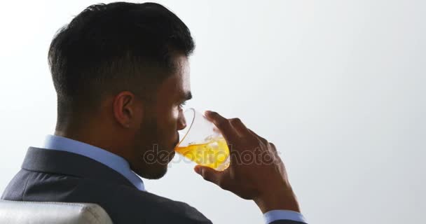 Businessman having juice — Stock Video