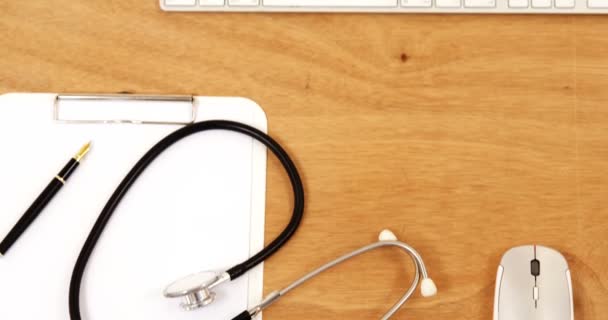 Keyboard with mouse, stethoscope, pen and clipboard — Stock Video