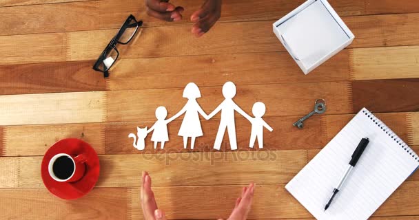 Cutout paper chain family with protection of hands — Stock Video