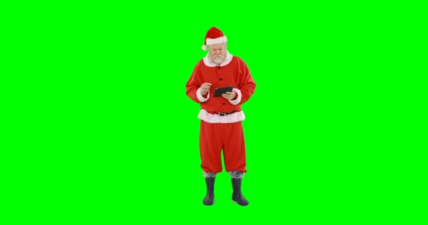 Santa claus using digital tablet — Stock Video