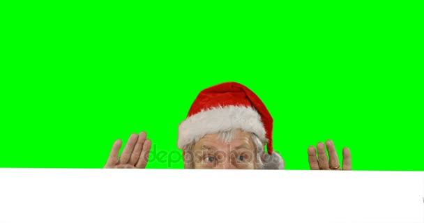 Überrascht Weihnachtsmann claus versteckt — Stockvideo