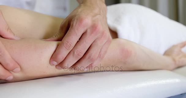 Physiotherapist giving hand massage to a woman — Stock Video