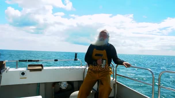 Fisherman having cup of coffee — Stock Video