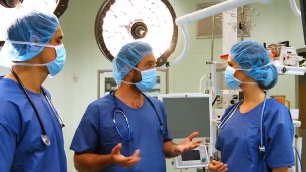 Surgeons interacting with each other — Stock Video