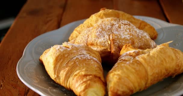 Plate with croissants on table — Stock Video