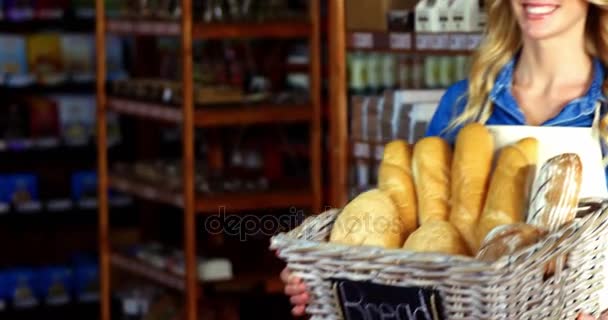 Woman holding a basket of baguettes — Stock Video