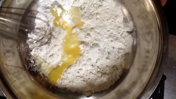 Chef whisking cake flour with egg yolk — Stock Video