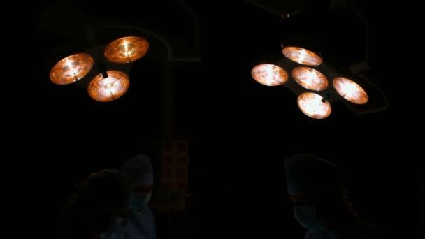 Surgeons performing operation in operation room — Stock Video