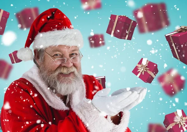 Weihnachtsmann gibt vor, Geschenke zu halten — Stockfoto