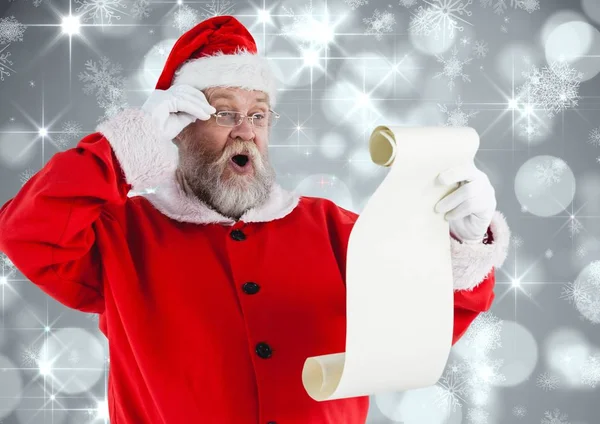 Weihnachtsmann liest Wunschliste — Stockfoto