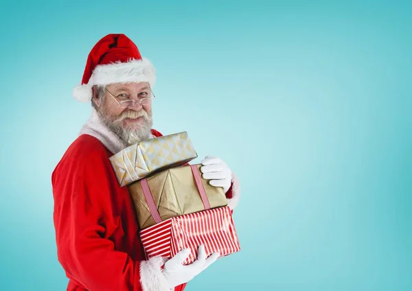 Noel hediyeleri Noel Baba holding yığını — Stok fotoğraf