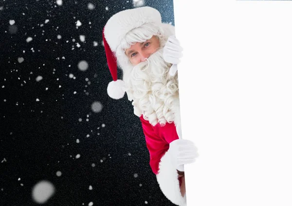 Papai Noel espreitando por trás da parede — Fotografia de Stock