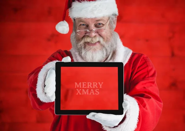 Santa Claus houden een digitale tablet — Stockfoto