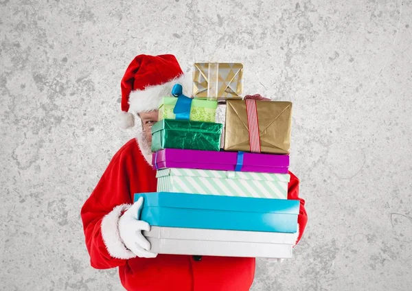 Santa claus holding gift boxes — Stock Photo, Image