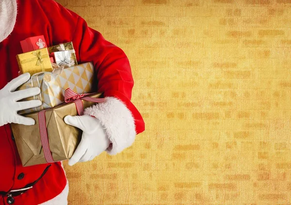 Santa claus carrying christmas gifts — Stock Photo, Image