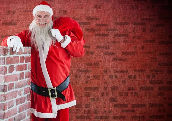 Санта-Клаус с подарочным пакетом — стоковое фото