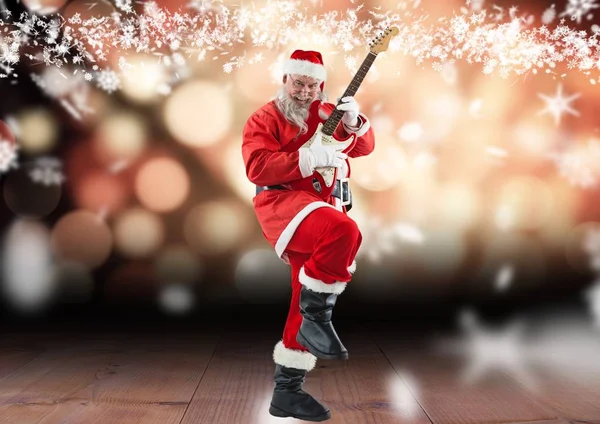 Santa claus playing electric guitar — Stock Photo, Image