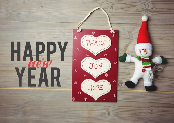 Happy christmas sign on wooden background — Stock Photo, Image