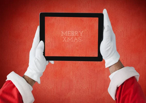 Rukou santa Claus drží tablet s digitální — Stock fotografie