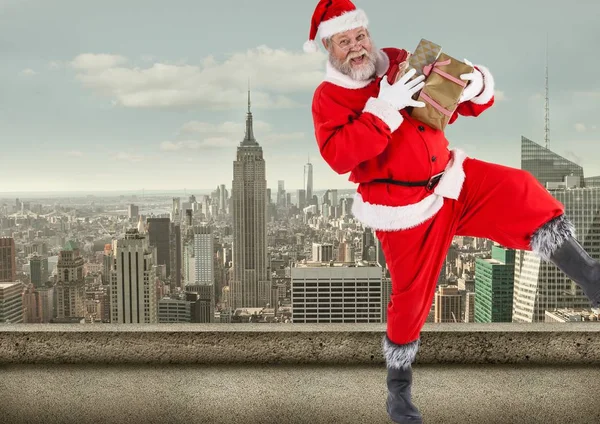 Santa claus  holding gift boxes — Stock Photo, Image