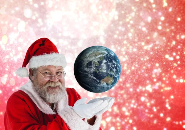 Weihnachtsmann täuscht Globus vor — Stockfoto