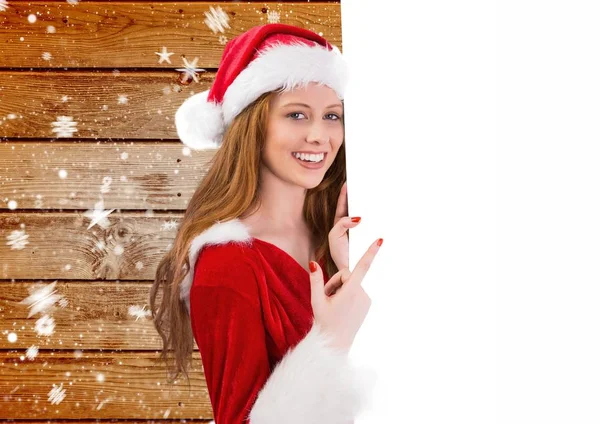 Donna in costume da Babbo Natale che indica il cartello — Foto Stock