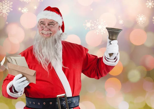 Santa claus holding envelopes and christmas bell — Stock Photo, Image