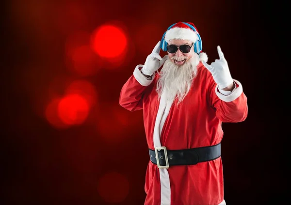 Rock n roll santa claus listening to music — Stock Photo, Image