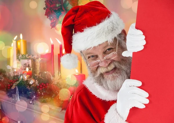 Santa gluren uit achter de muur — Stockfoto