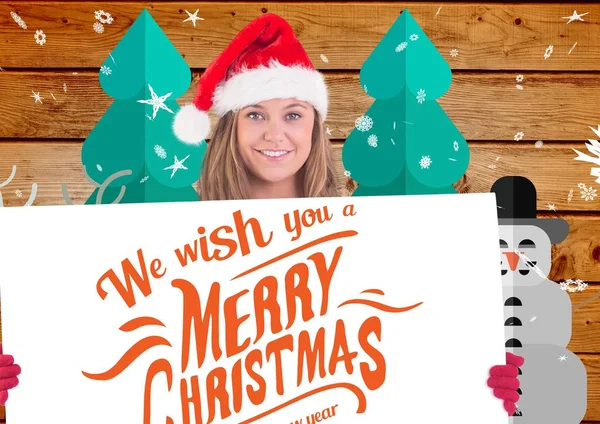 Frau mit Weihnachtsmannhut hält Plakat hoch — Stockfoto