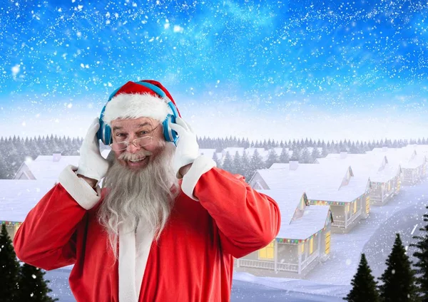 Santa listening music on headphones — Stock Photo, Image