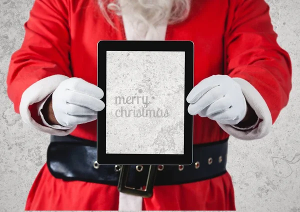 Handen van santa claus houden een digitale tablet — Stockfoto