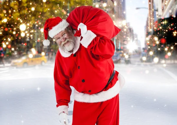 Santa Claus con bolsa de regalo caminando —  Fotos de Stock