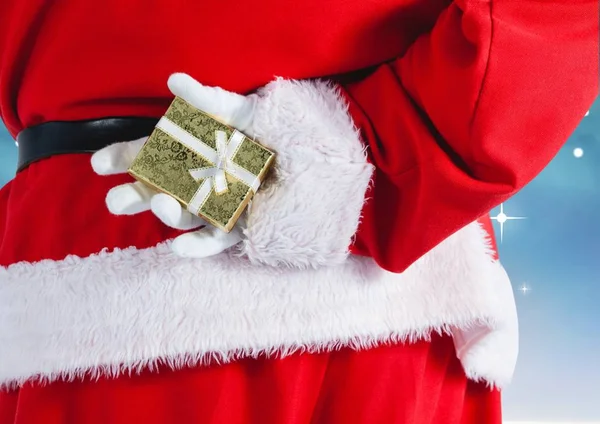 Santa Claus escondiendo regalo detrás de su espalda —  Fotos de Stock