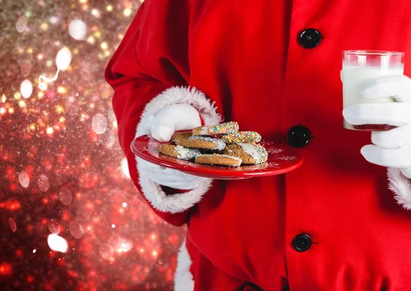 Santa mano sosteniendo galletas — Foto de Stock