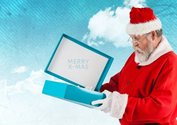 Santa Claus abre una caja de regalo —  Fotos de Stock