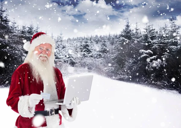 Santa claus haciendo compras en línea desde el ordenador portátil —  Fotos de Stock