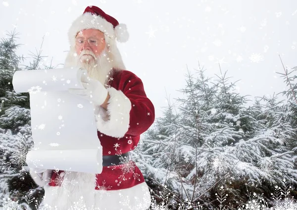 Santa claus segurando checklist — Fotografia de Stock