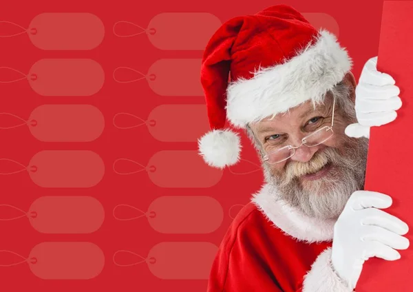 Papai Noel espreitando por trás do muro — Fotografia de Stock