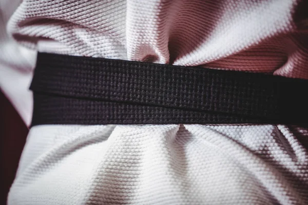 Karate player in black belt — Stock Photo, Image