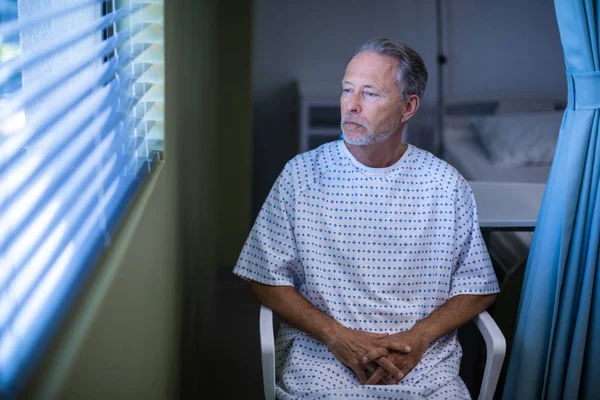 Sick patient sitting on chair — Stock Photo, Image